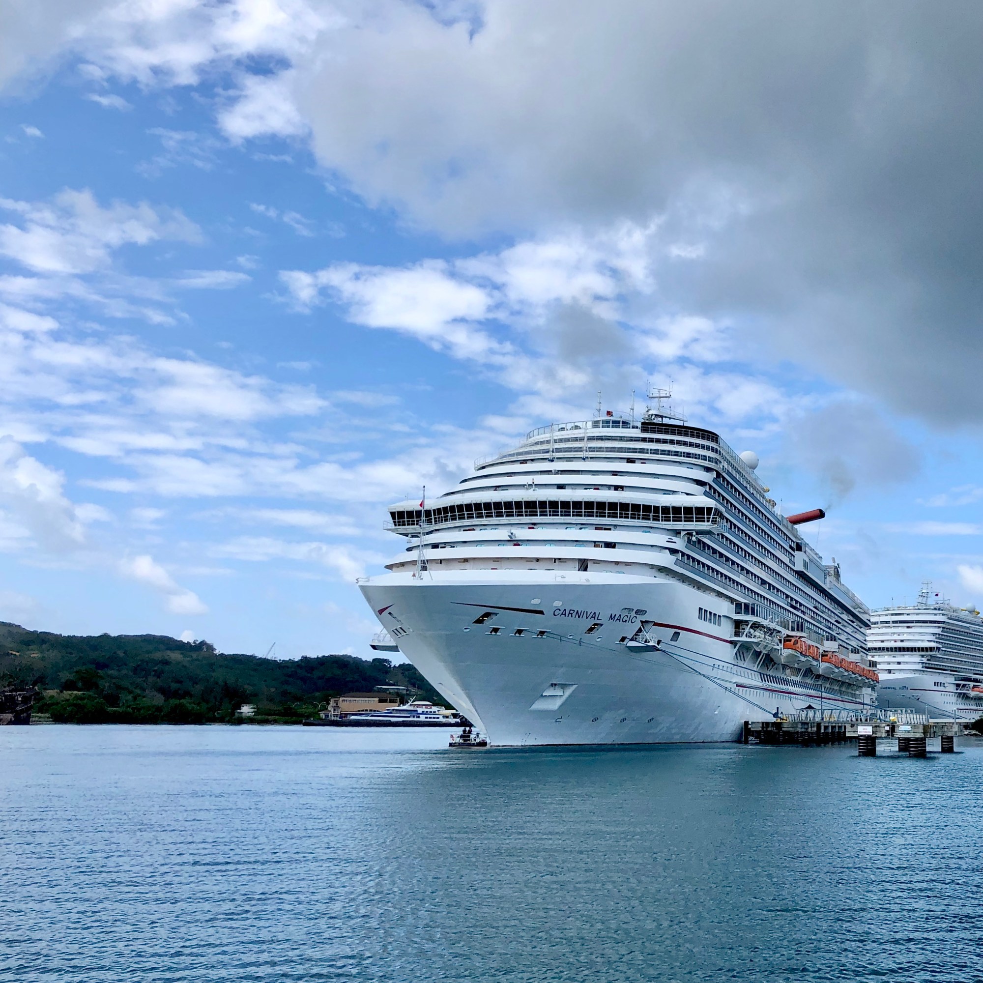 Cruise ship at port on island.